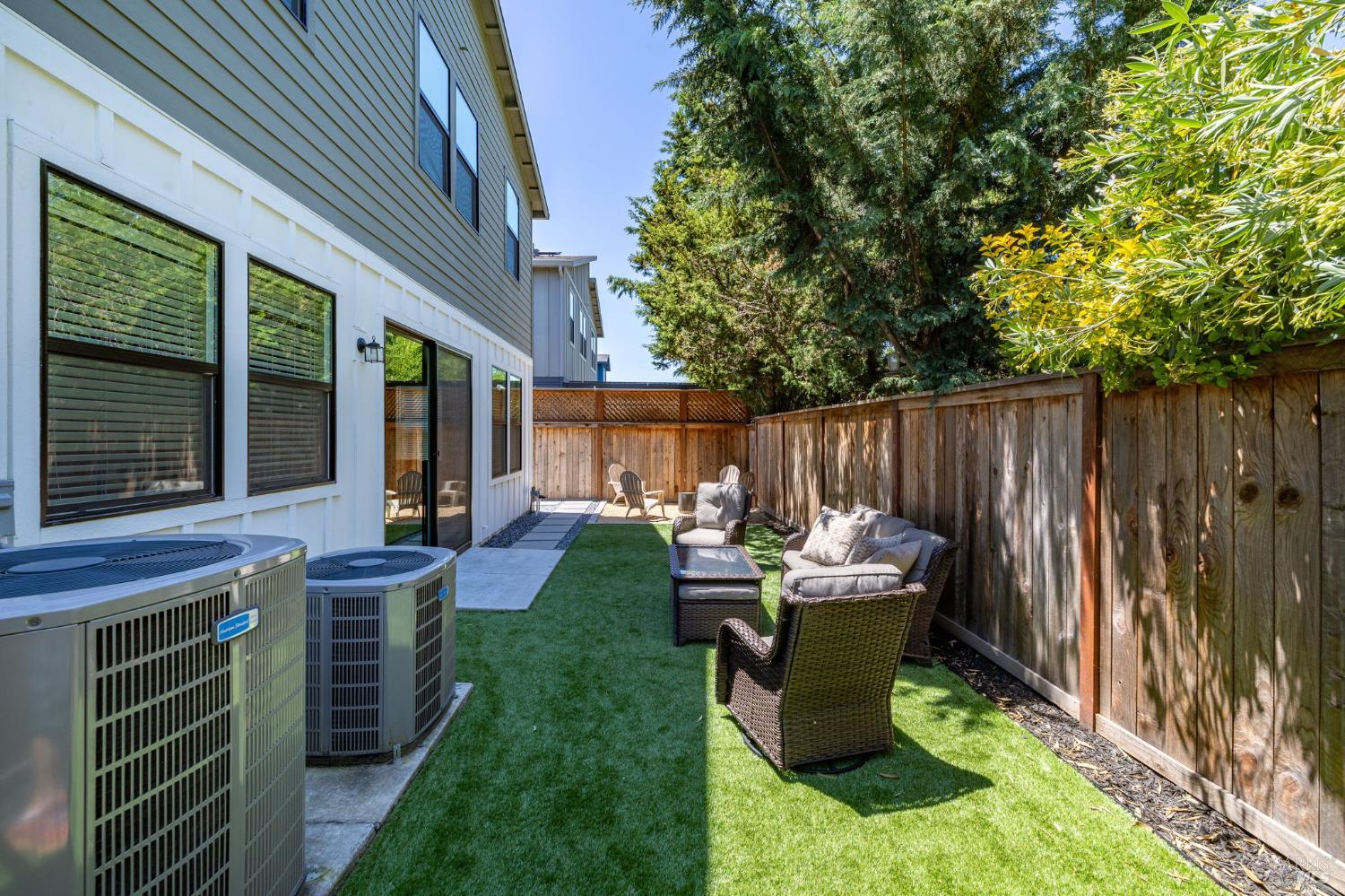 2215-2217 Versaro Drive Santa Rosa, CA 95403 - Photo 40 of 45 a backyard of a house with table and chairs