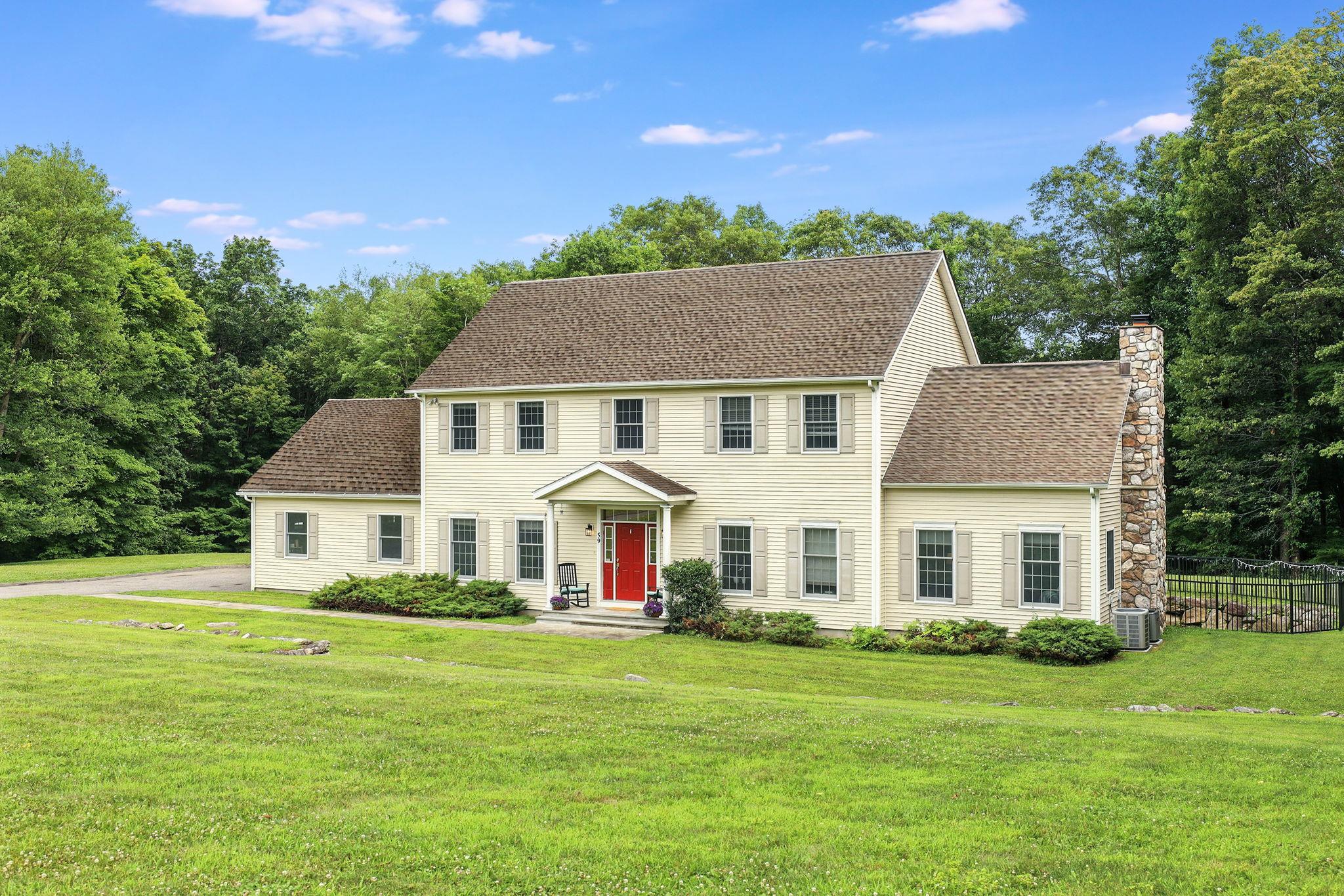 59 White Rock Road Putnam Valley, NY 10579 - Photo 1 of 1 a front view of a house with a garden