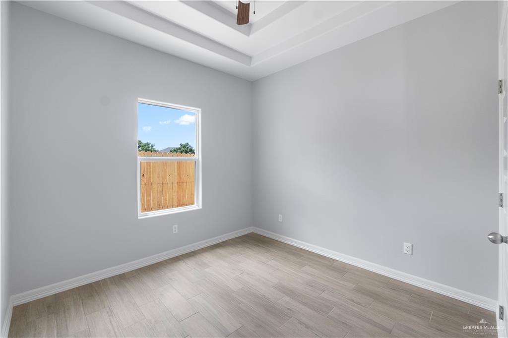 500 Bridget Street Weslaco, TX 78596 - Photo 8 of 14 an empty room with a window