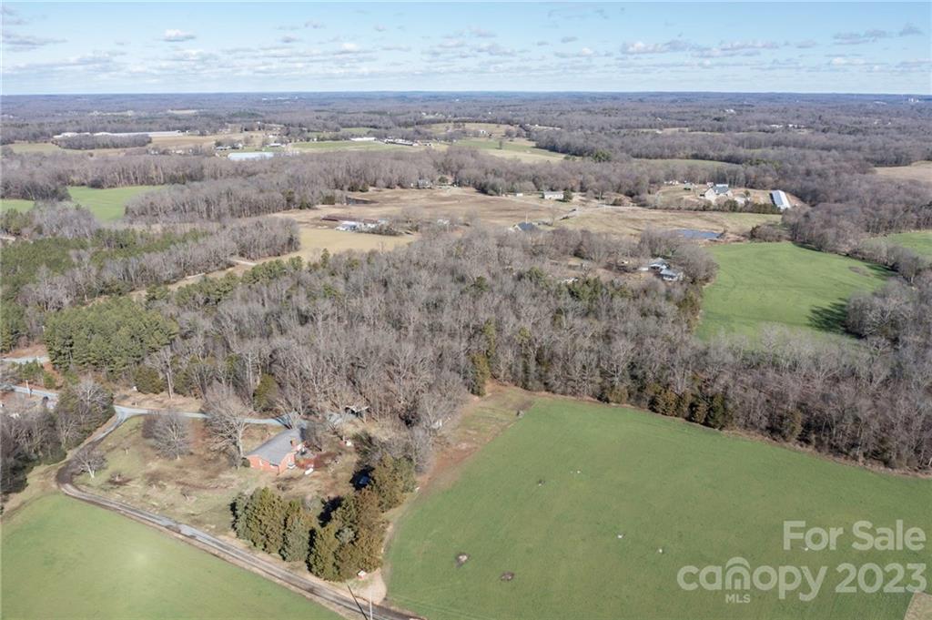 7607 Tesh Road Monroe, NC 28110 - Photo 1 of 31 a view of a lake with a yard