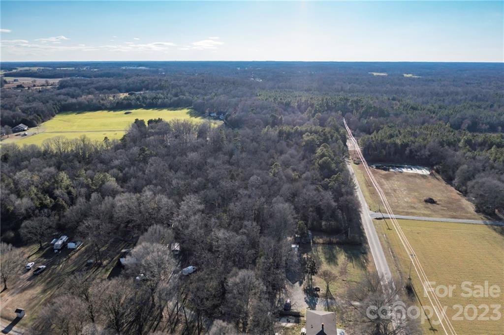 7607 Tesh Road Monroe, NC 28110 - Photo 11 of 31 a view of a swimming pool next to a yard