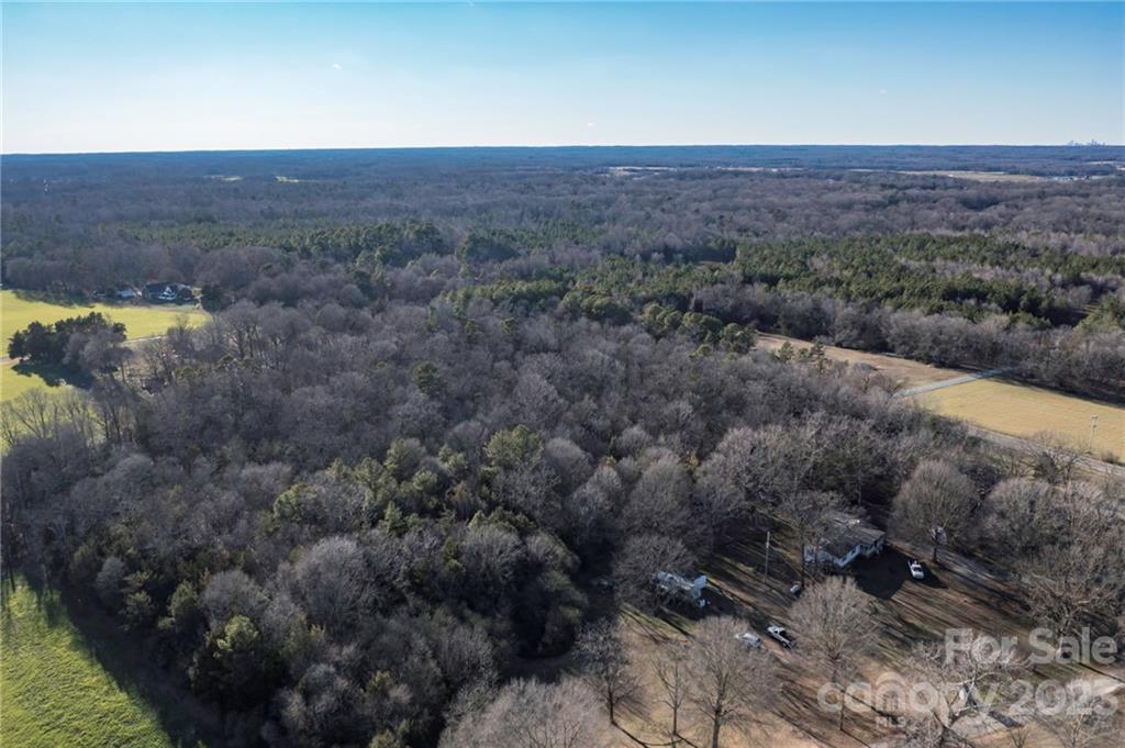 7607 Tesh Road Monroe, NC 28110 - Photo 12 of 31 a view of a lake in middle of forest