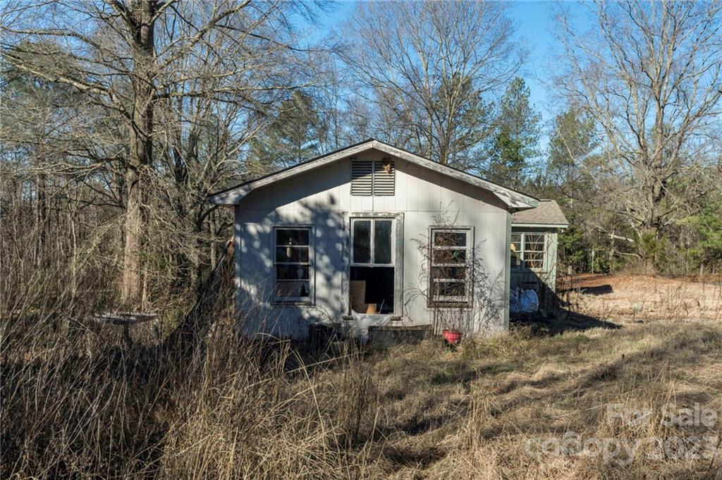 7607 Tesh Road Monroe, NC 28110 - Photo 28 of 31 a front view of house with yard and trees in the background