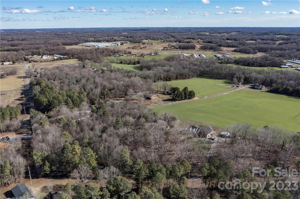 7607 Tesh Road Monroe, NC 28110 - Photo 3 of 31 a view of a lake with green space