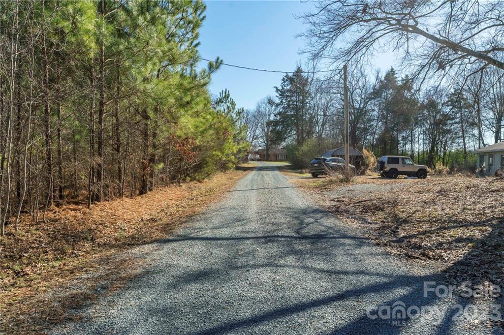 7607 Tesh Road Monroe, NC 28110 - Photo 31 of 31 a backyard of a house with trees and houses
