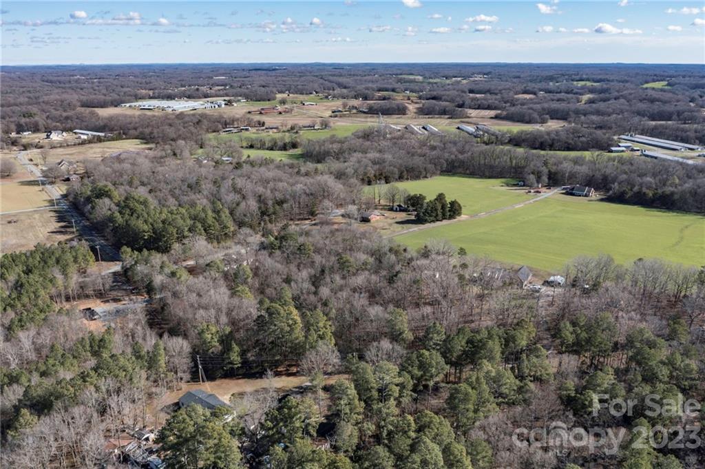 7607 Tesh Road Monroe, NC 28110 - Photo 4 of 31 a view of a lake with a city