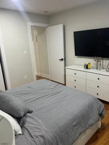 a bedroom with a bed and a sink