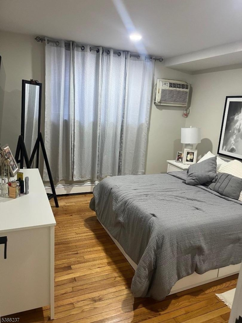 744 Hazard Place, Unit 1F Elizabeth, NJ 07208 - Photo 8 of 12 a bedroom with a bed and a sink