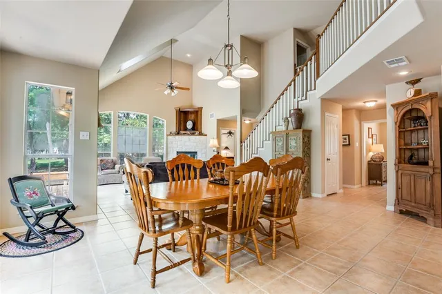 a view of a dining room with furniture window and outside view