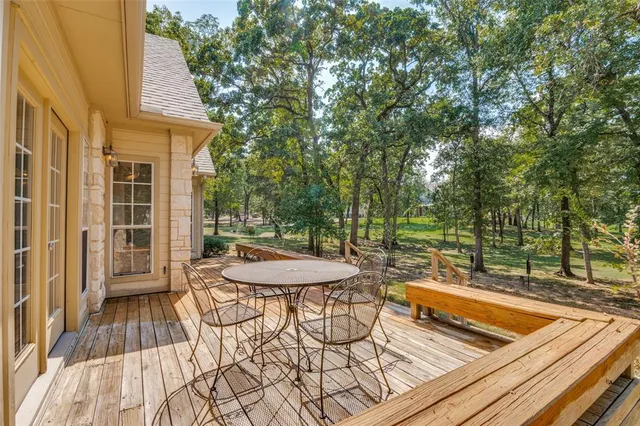 swimming pool view with a seating space