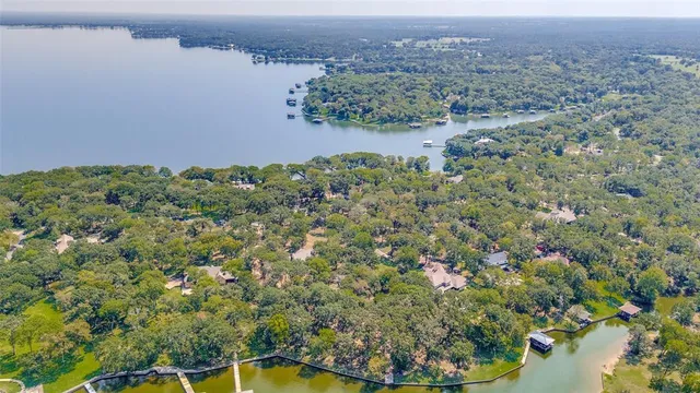 an aerial view of a houses with a yard