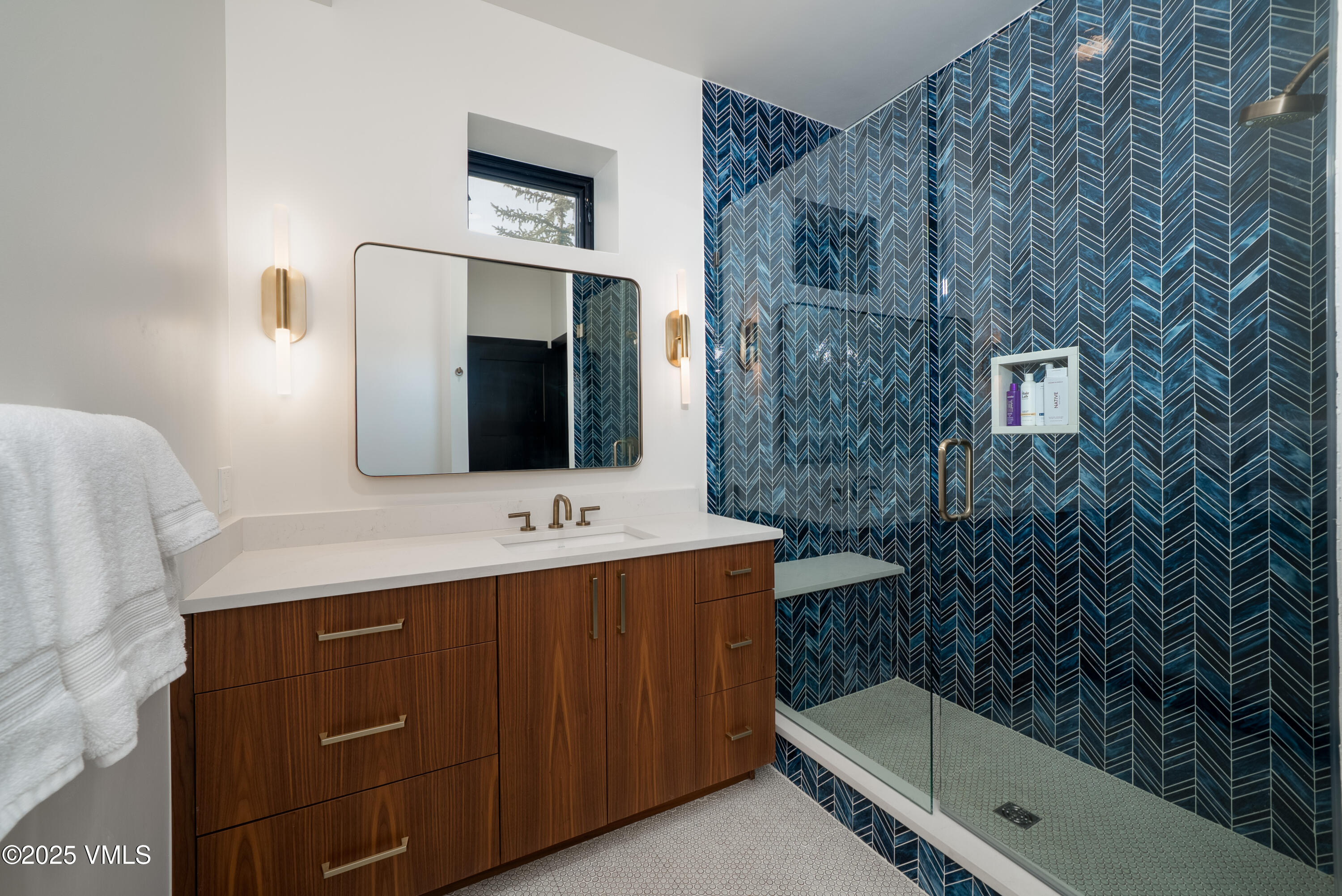 533 Settlers Loop Edwards, CO 81632 - Photo 14 of 29 a bathroom with a sink a mirror and shower