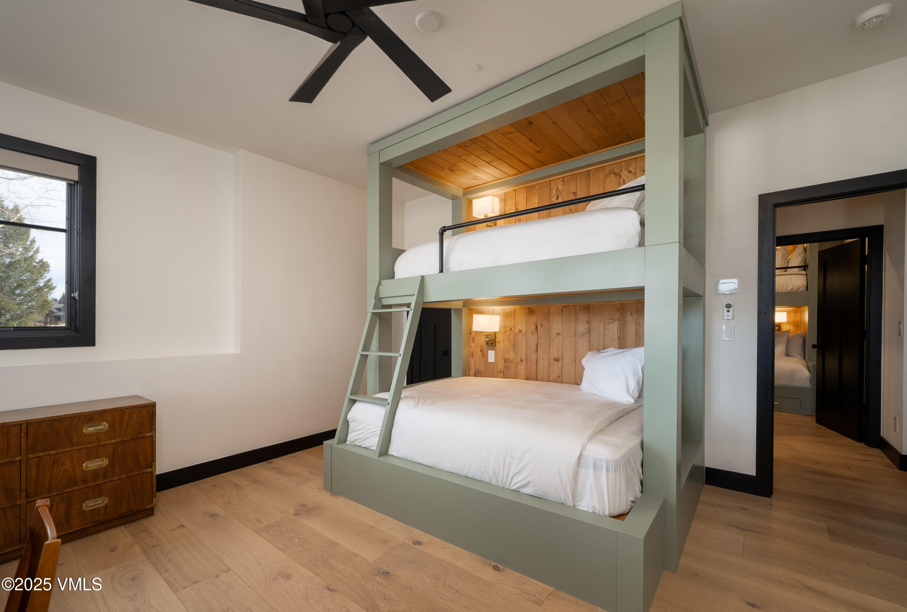 533 Settlers Loop Edwards, CO 81632 - Photo 15 of 29 a bedroom with a bed and wooden floor