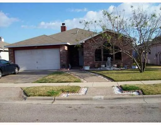 a front view of house with garage and yard