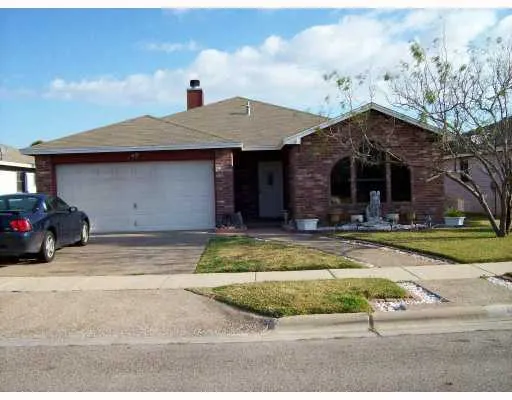 a view of a house with swimming pool and a yard