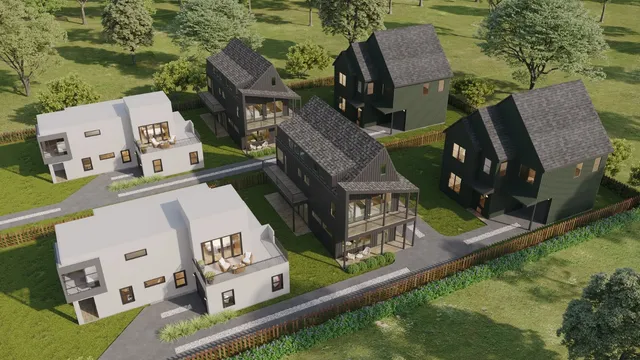 an aerial view of residential houses with outdoor space