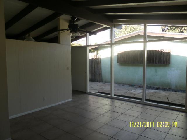 1230 Mercedes Lane Santa Barbara, CA 93101 - Photo 9 of 13 a view of empty room with wooden floor and fan