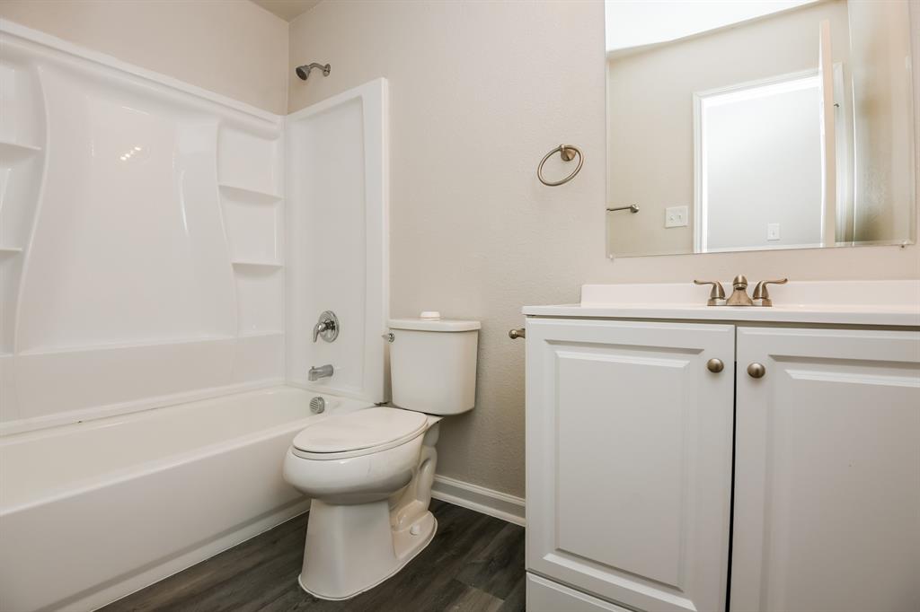6900 Chaco Trail Fort Worth, TX 76137 - Photo 14 of 17 a bathroom with a sink toilet and shower