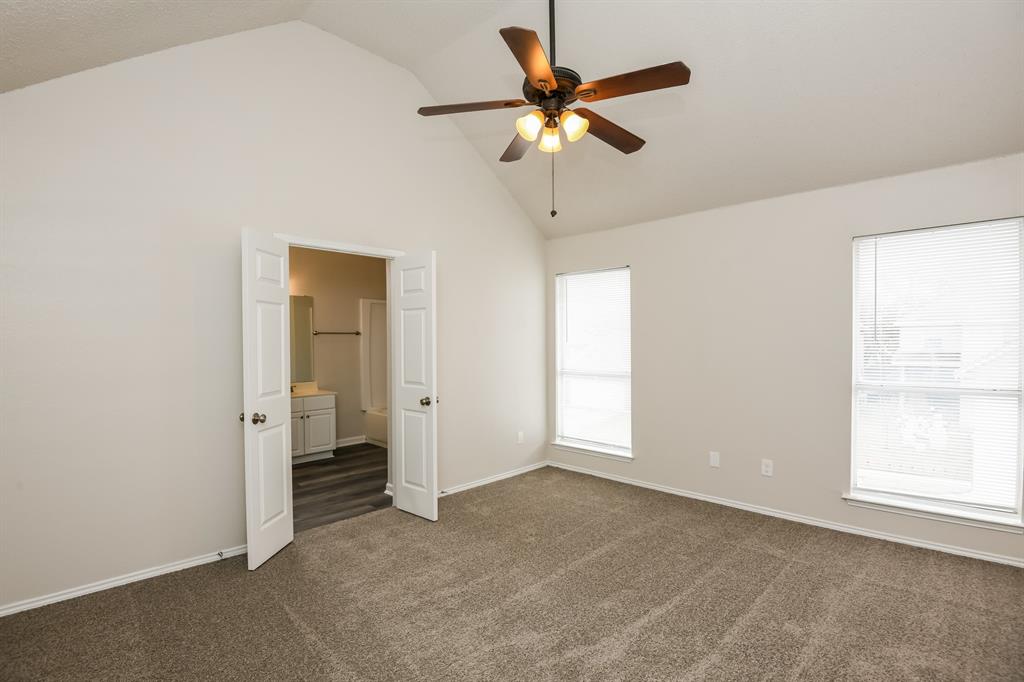 6900 Chaco Trail Fort Worth, TX 76137 - Photo 9 of 17 an empty room with closet and a chandelier fan