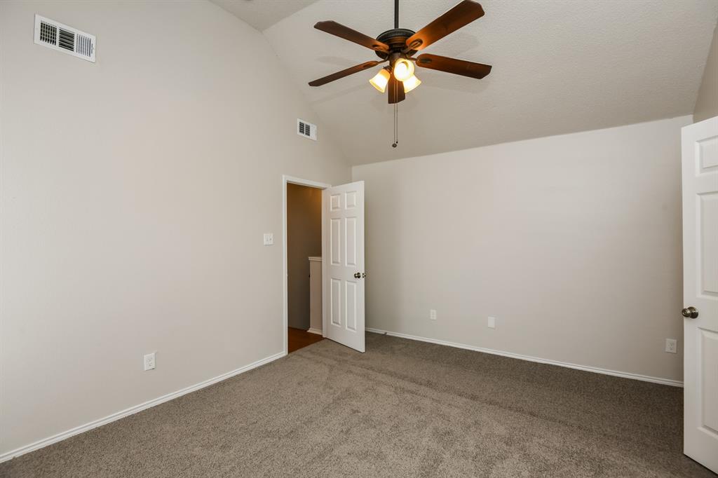 6900 Chaco Trail Fort Worth, TX 76137 - Photo 10 of 17 an empty room with a fan and a fan