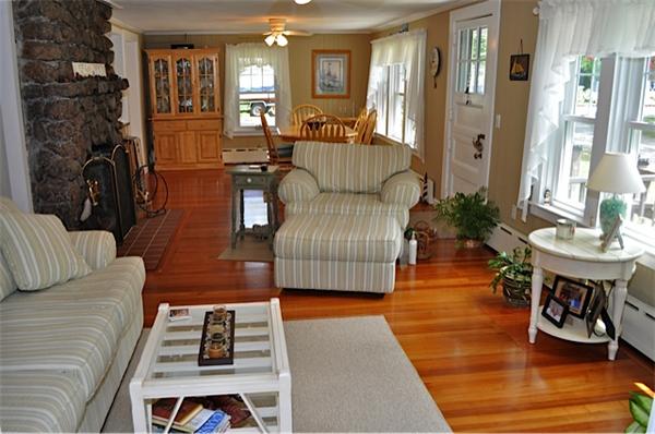 9 Wianno Road Marion, MA 02738 - Photo 4 of 10 a living room with furniture and a fireplace