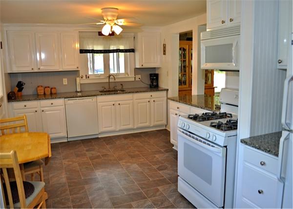 9 Wianno Road Marion, MA 02738 - Photo 6 of 10 a kitchen with a stove a sink and a refrigerator