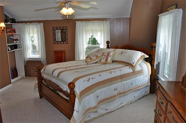 9 Wianno Road Marion, MA 02738 - Photo 8 of 10 a bedroom with a bed and window