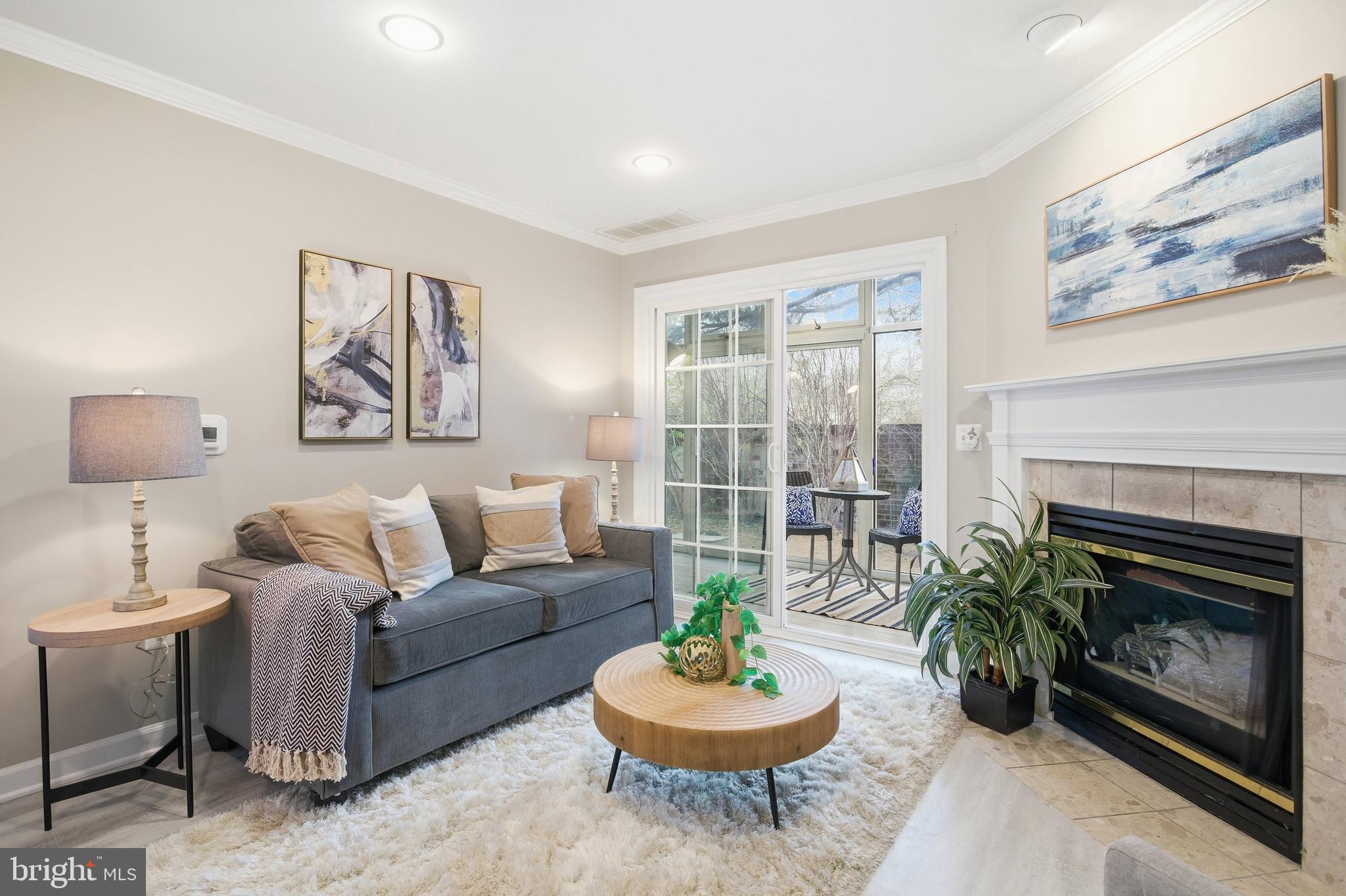6924 Fairfax Drive, Unit 122 Arlington, VA 22213 - Photo 14 of 30 a living room with furniture and a fireplace