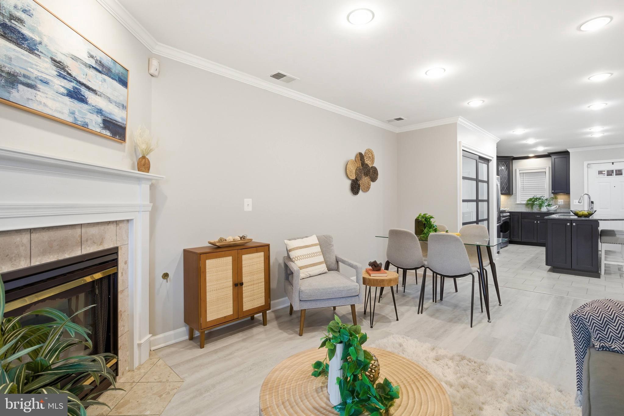 6924 Fairfax Drive, Unit 122 Arlington, VA 22213 - Photo 15 of 30 a living room with furniture and a fireplace