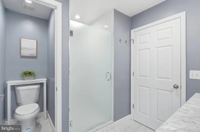 a bathroom with a toilet and a sink