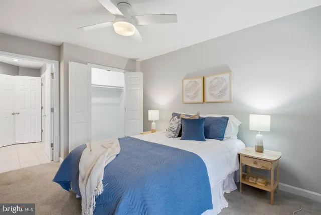 a bedroom with a bed and a lamp