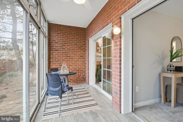 a view of a patio with chair and tables