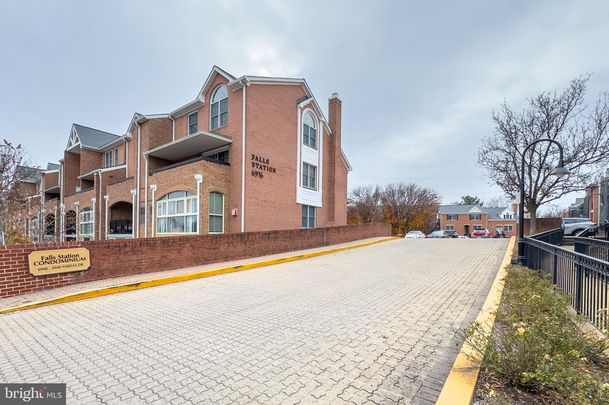 6924 Fairfax Drive, Unit 122 Arlington, VA 22213 - Photo 25 of 30 a view of a house with cars park