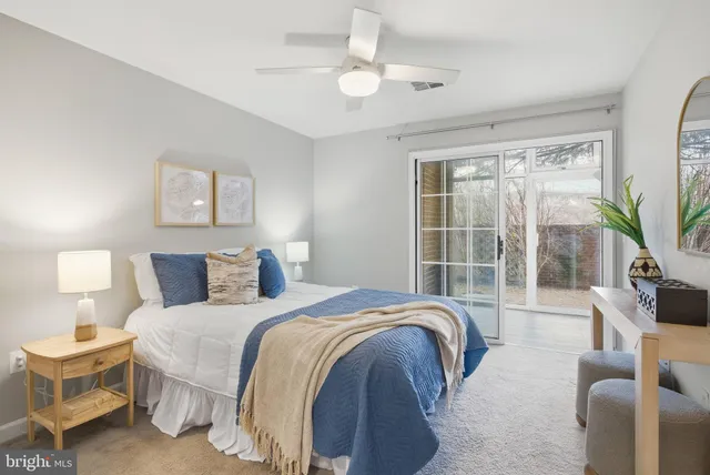 a bedroom with a large bed and a large window