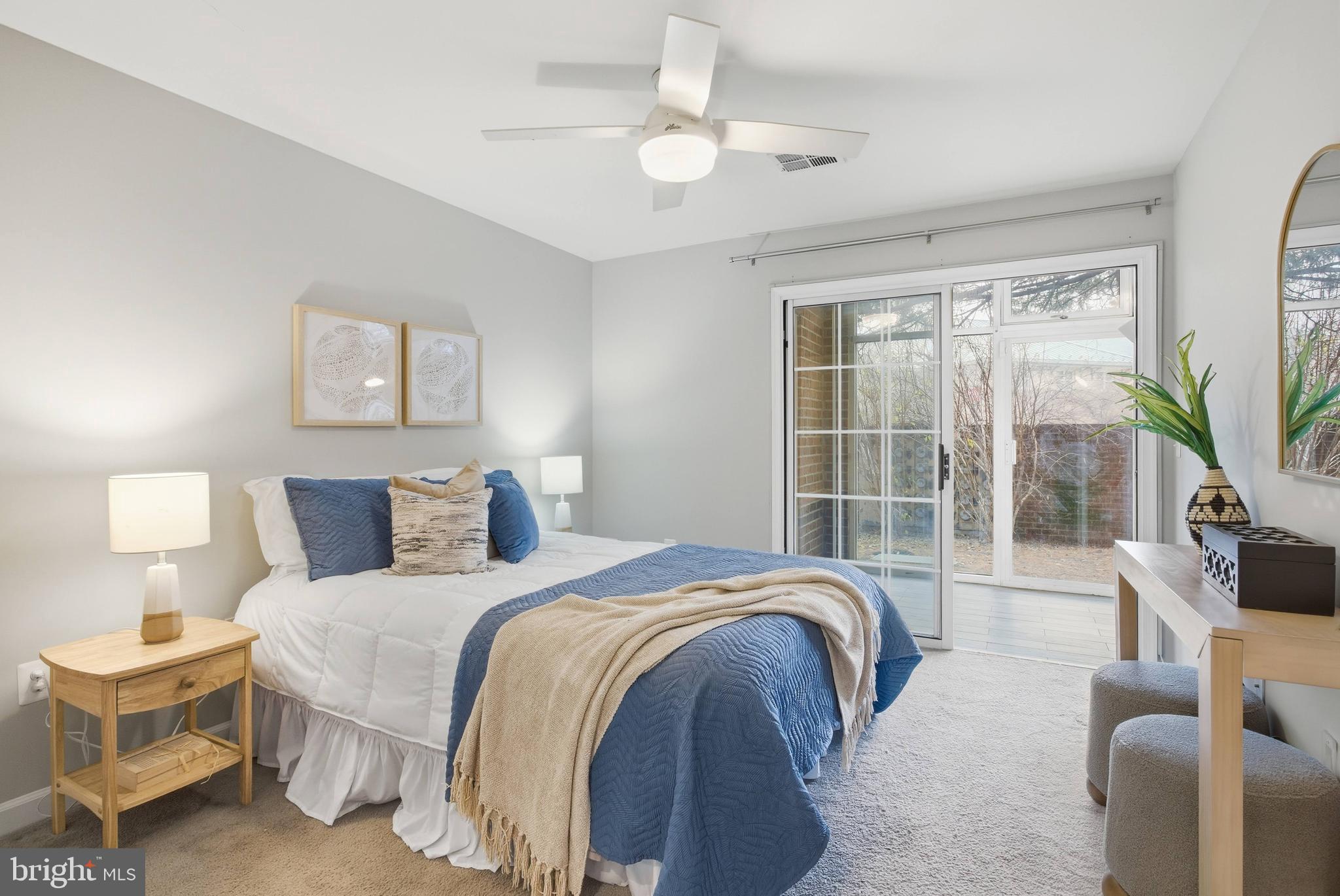 6924 Fairfax Drive, Unit 122 Arlington, VA 22213 - Photo 5 of 30 a bedroom with a large bed and a large window