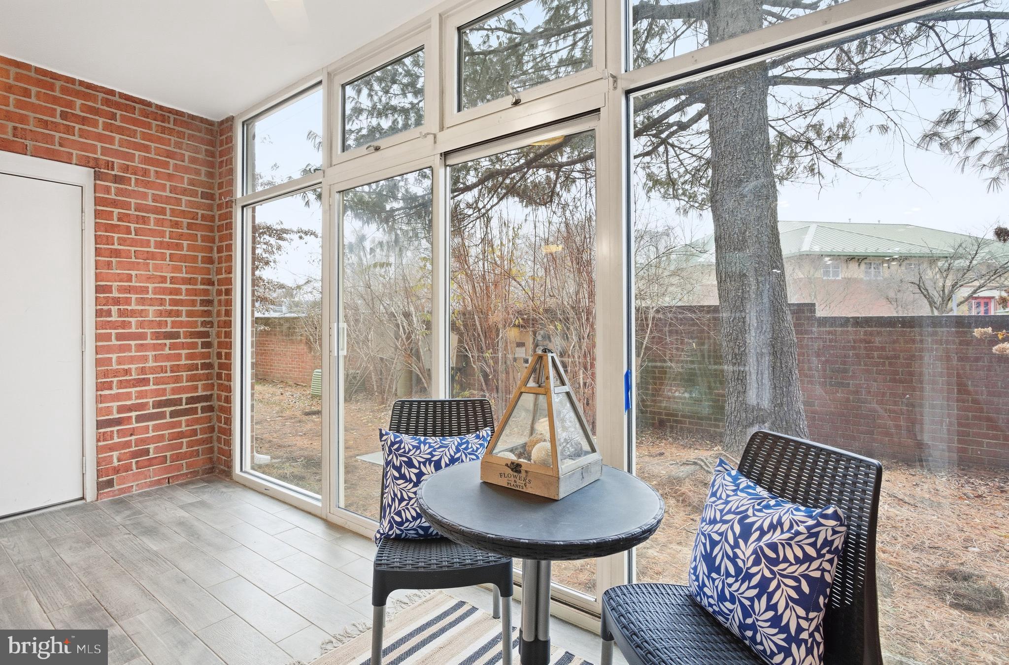 6924 Fairfax Drive, Unit 122 Arlington, VA 22213 - Photo 7 of 30 a view of a dining room with furniture and a window