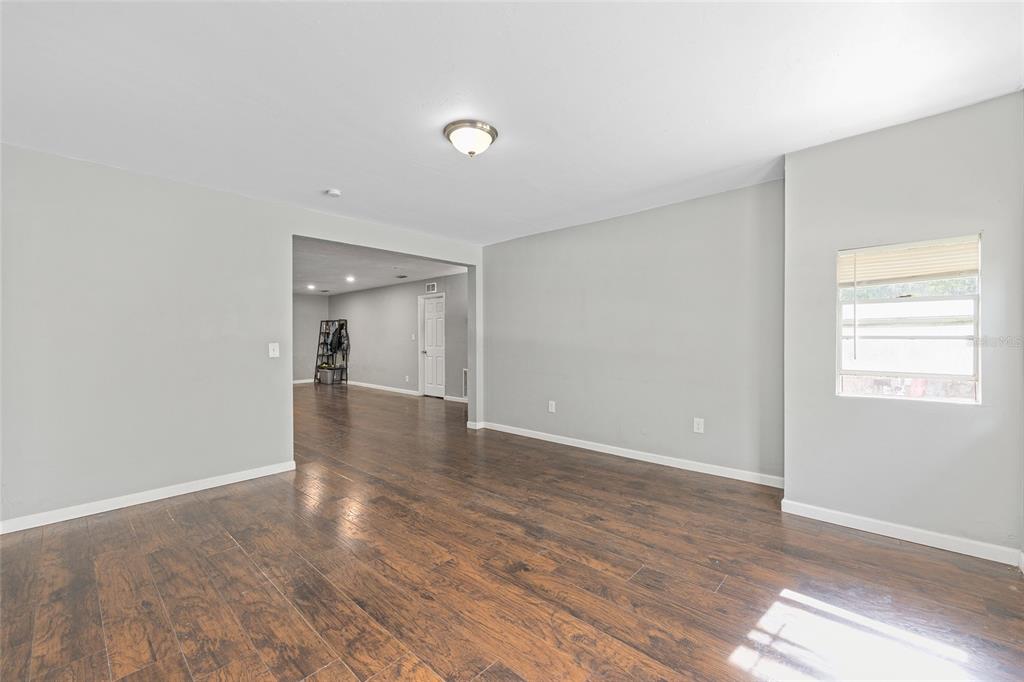 15120 Northeast 35th Avenue Road Citra, FL 32113 - Photo 22 of 34 a view of a room with wooden floor and a window