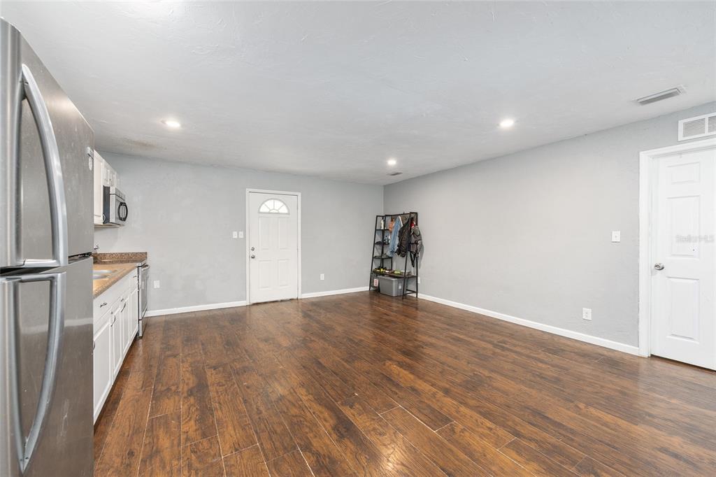 15120 Northeast 35th Avenue Road Citra, FL 32113 - Photo 6 of 34 a view of empty room with wooden floor