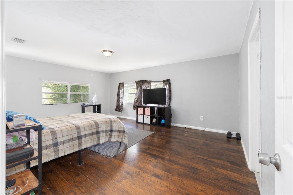 15120 Northeast 35th Avenue Road Citra, FL 32113 - Photo 10 of 34 a bedroom with two beds and a window