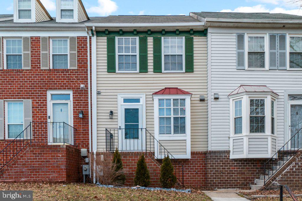 2412 Potterfield Road Windsor Mill, MD 21244 - Photo 1 of 36 a view of a brick house with many windows
