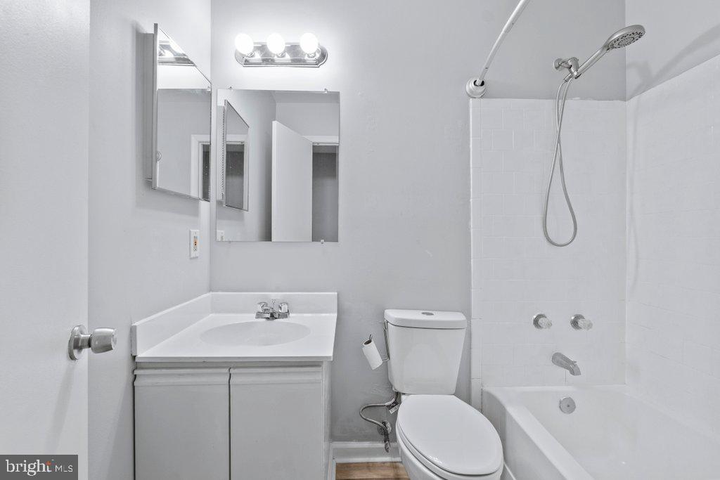 2412 Potterfield Road Windsor Mill, MD 21244 - Photo 21 of 36 a bathroom with a sink a toilet and shower