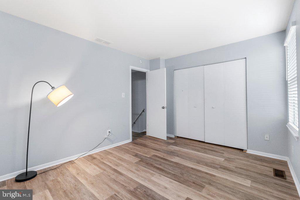2412 Potterfield Road Windsor Mill, MD 21244 - Photo 25 of 36 a view of empty room with wooden floor