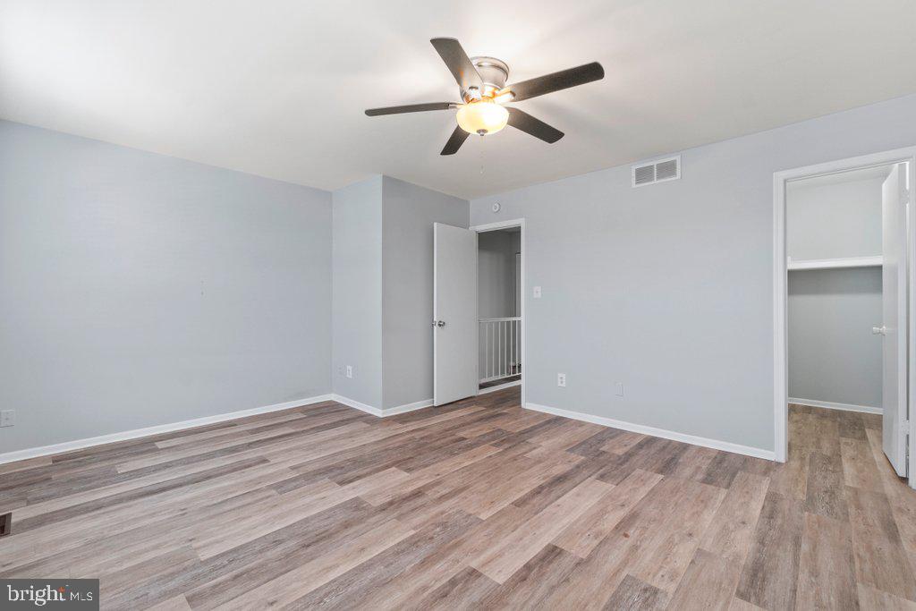 2412 Potterfield Road Windsor Mill, MD 21244 - Photo 29 of 36 a view of an empty room with wooden floor