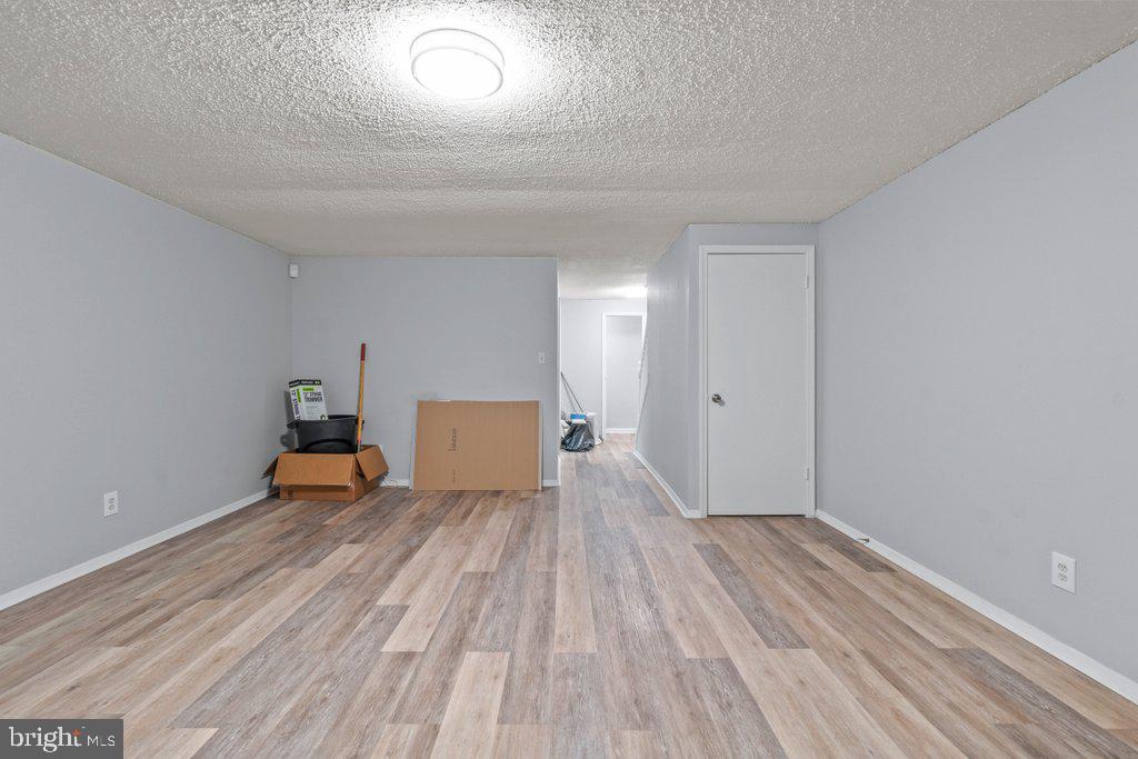 2412 Potterfield Road Windsor Mill, MD 21244 - Photo 32 of 36 a view of a room with wooden floor and a window