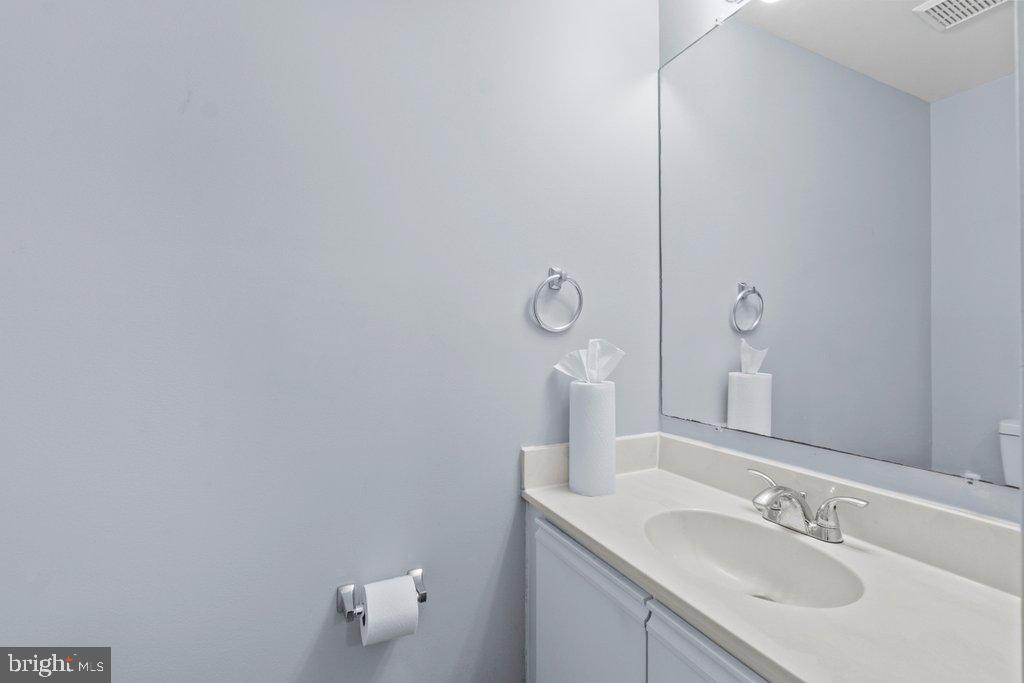 2412 Potterfield Road Windsor Mill, MD 21244 - Photo 6 of 36 a bathroom with a sink and mirror