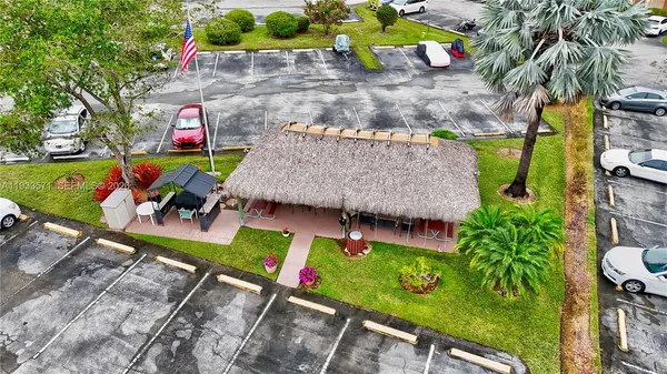 an aerial view of a chairs and table in the patio