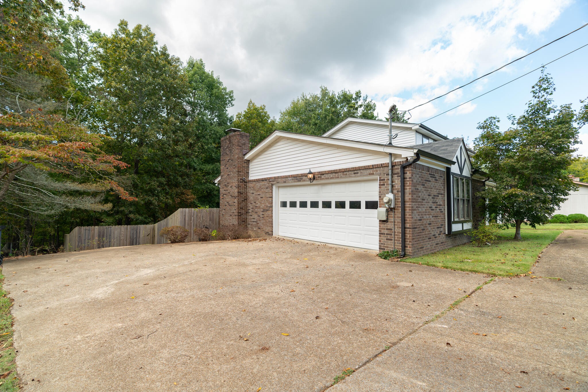 1820 Rock Bluff Road Hixson, TN 37343 - Photo 2 of 31 a view of a house with a yard and a garage