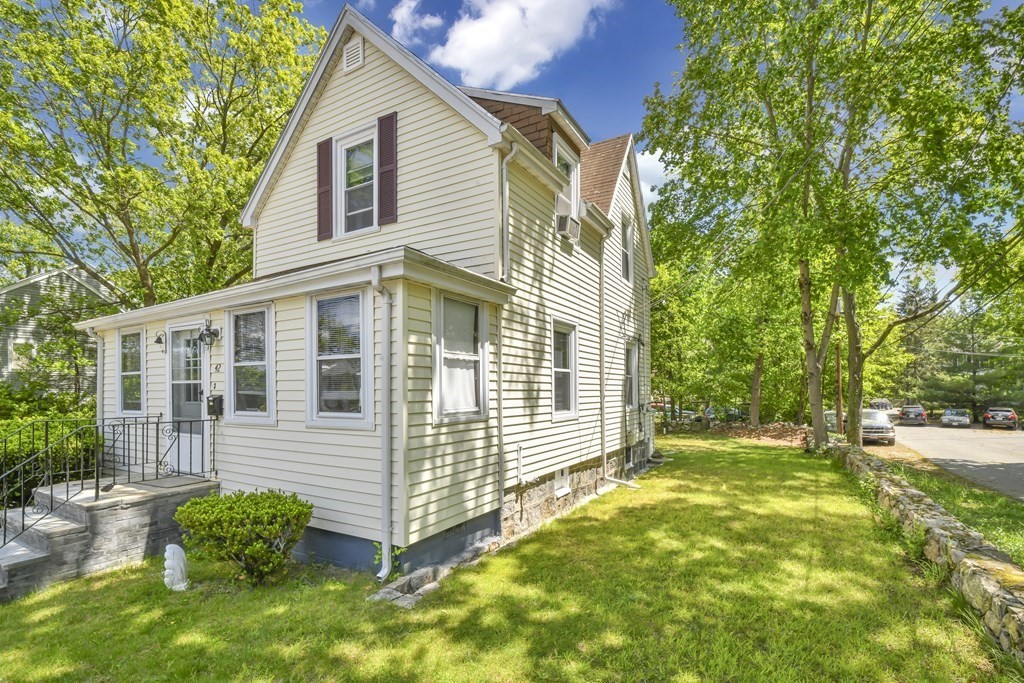 42 Vernon Street Boston, MA 02136 - Photo 3 of 12 a view of a house with a yard and a garden