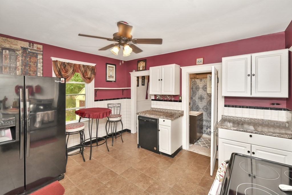 42 Vernon Street Boston, MA 02136 - Photo 4 of 12 a kitchen with stainless steel appliances kitchen island granite countertop a refrigerator and microwave