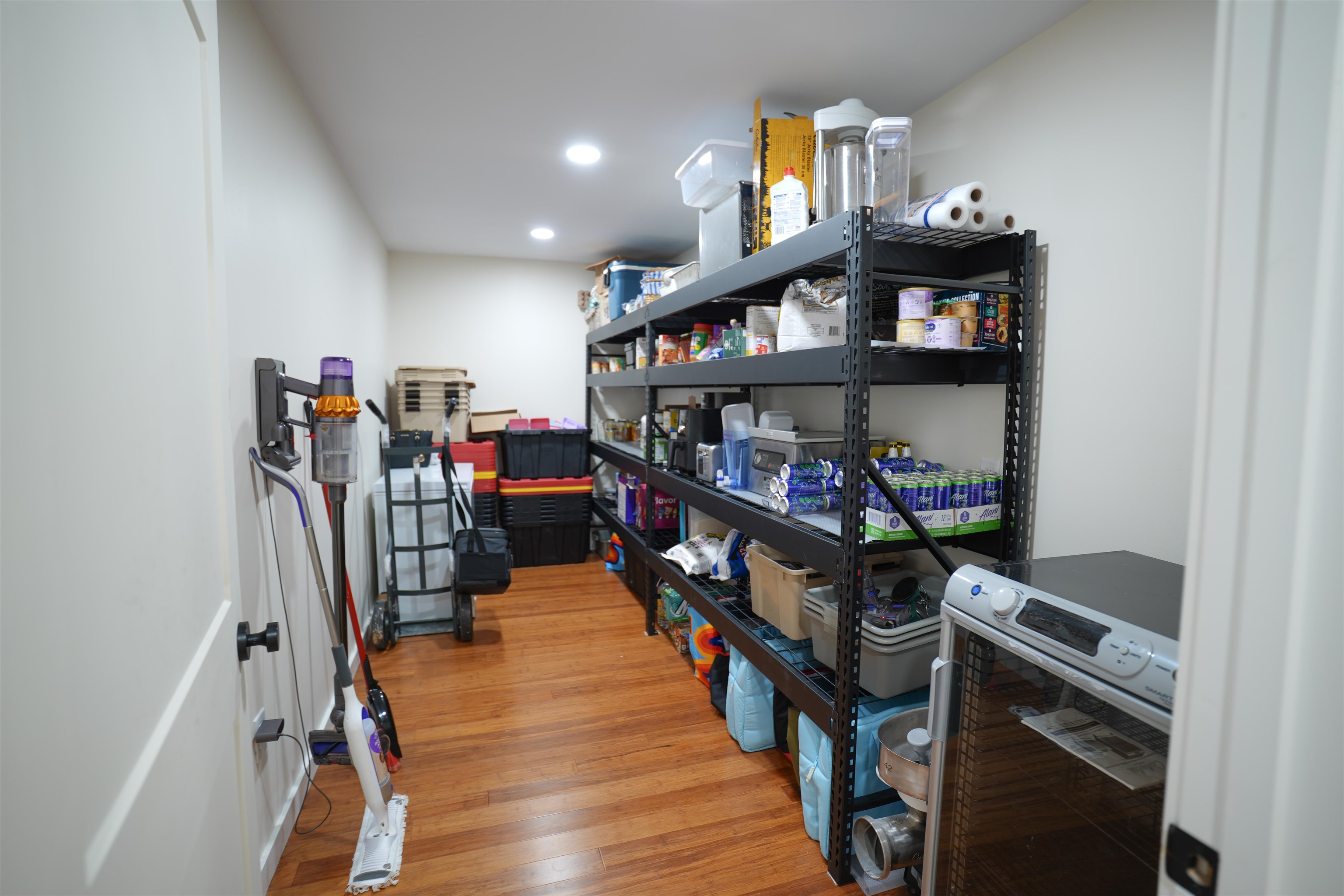 2525 Pittman Road Somerville, TN 38068 - Photo 9 of 38 Recessed lighting illuminates the space, featuring wood-finish flooring and ample shelving
